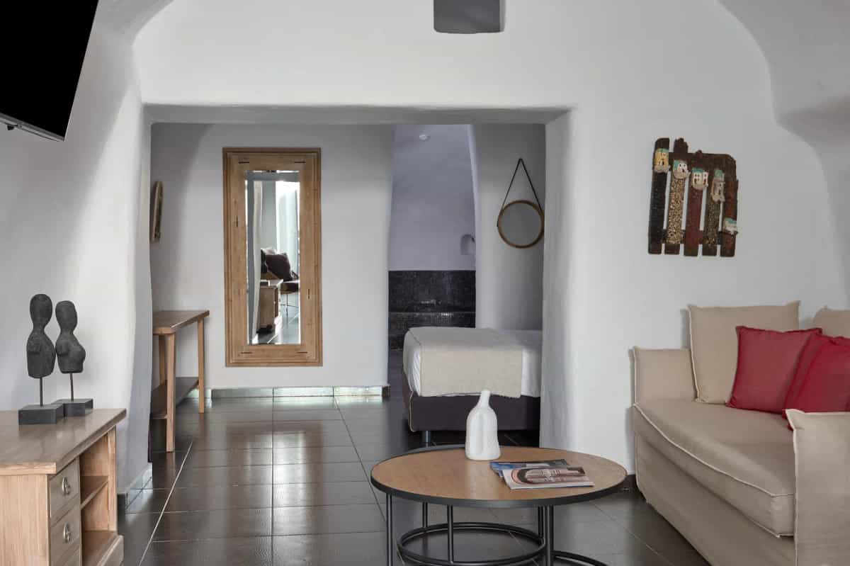 Cave suite living area with comfortable seating at Aroma Suites
