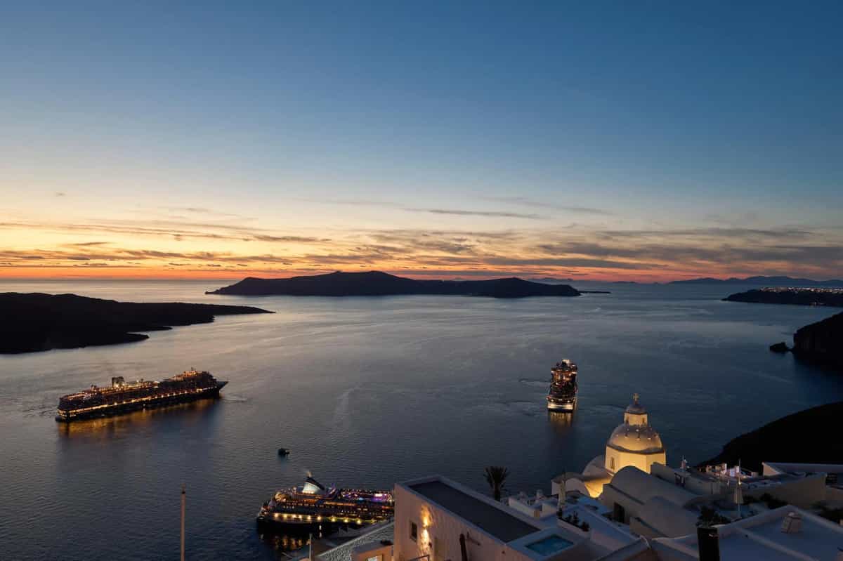 Panoramic Santorini sunset with caldera and volcanic islands