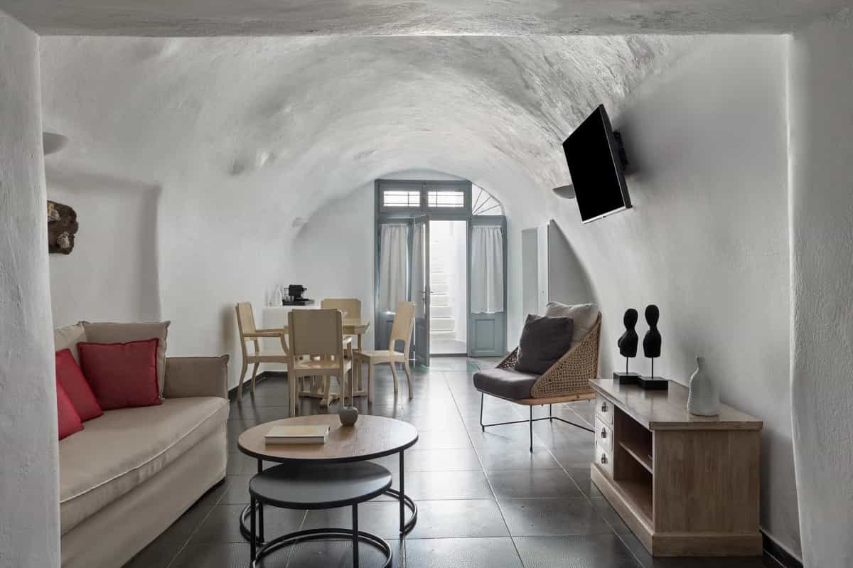 Suite bedroom with whitewashed walls and elegant furnishings