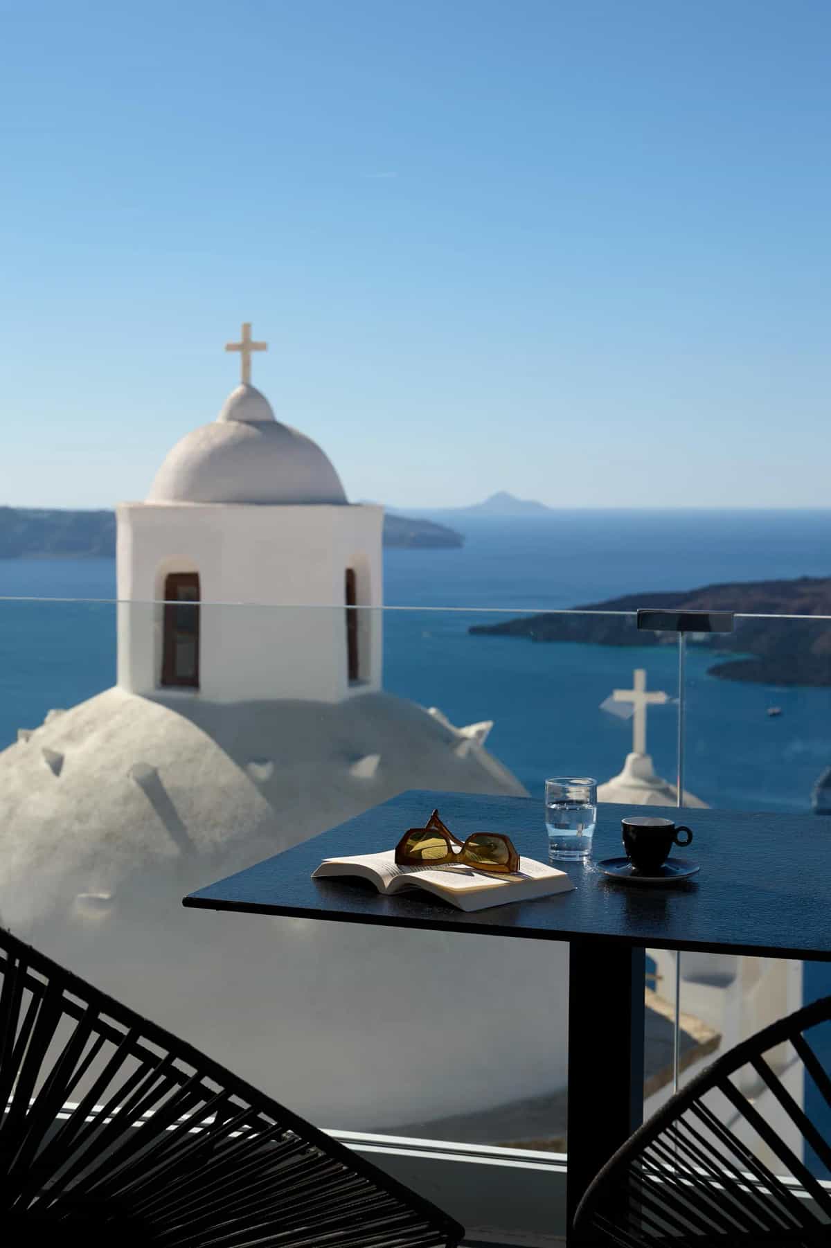 Sunset light over Santorini caldera and volcanic islands