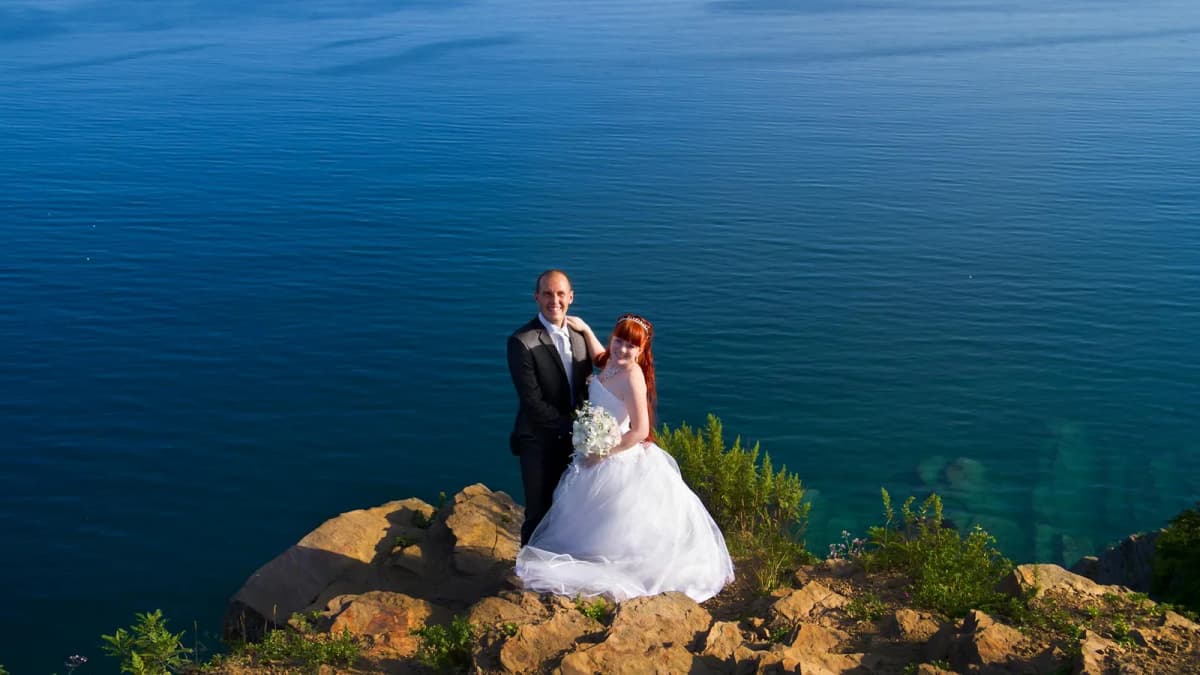 Wedding couple during an intimate elopement ceremony overlooking the Santorini caldera
