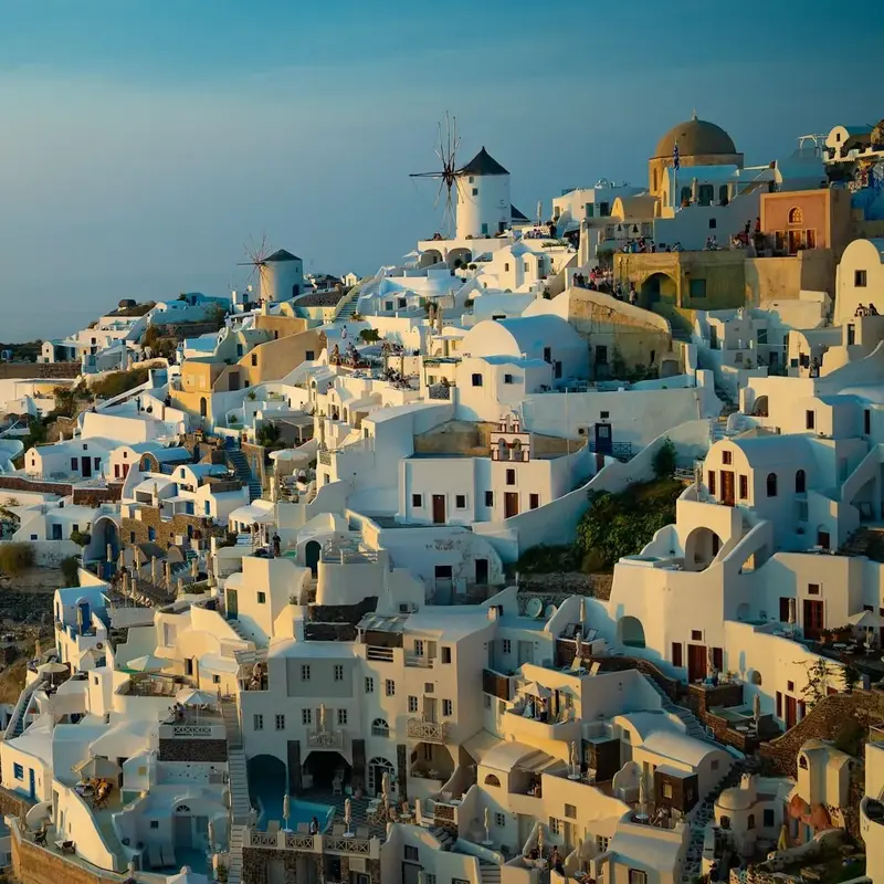 Oia's whitewashed houses and windmill seen from above