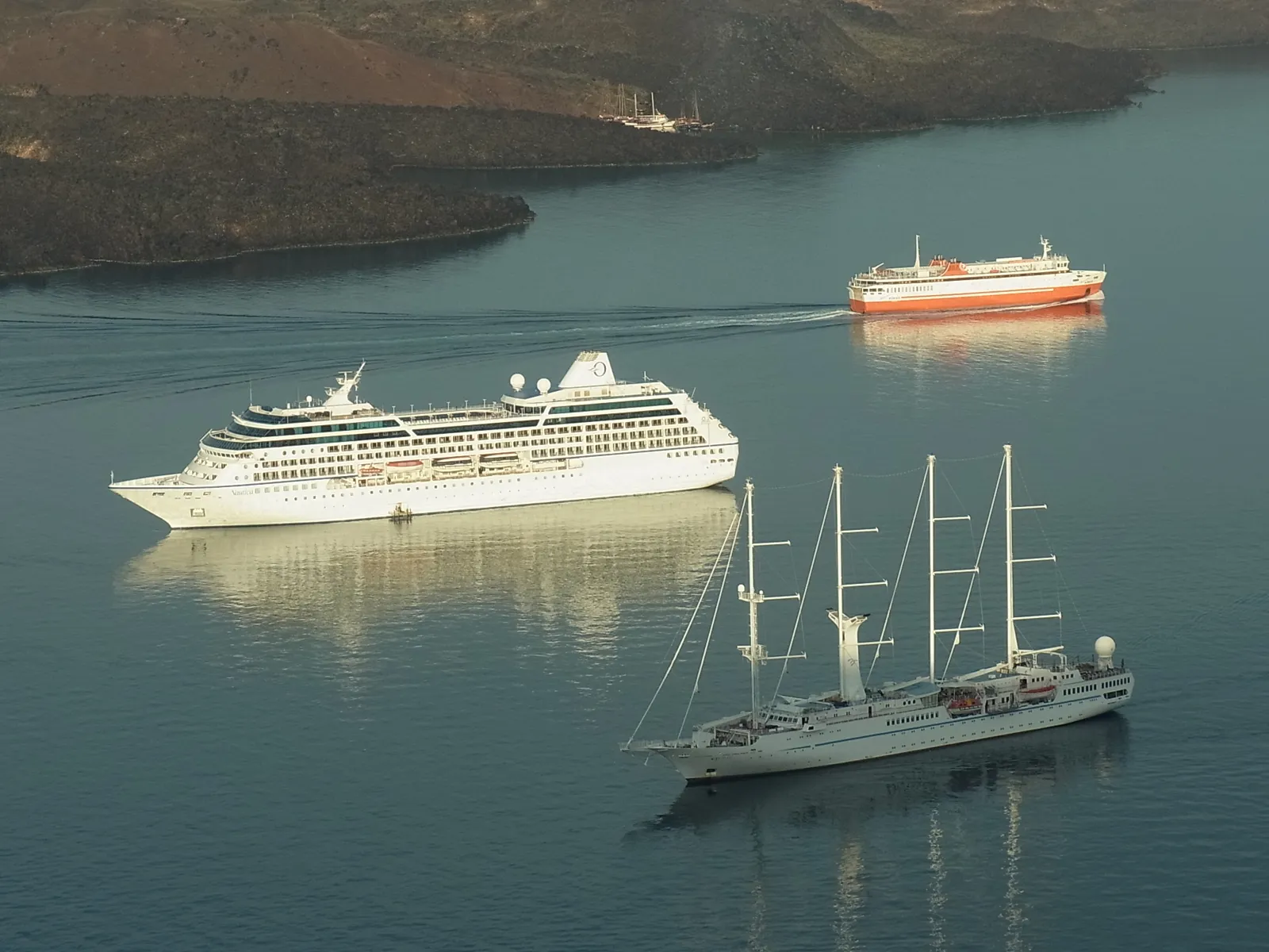 Cruise ships anchored in the Santorini caldera, seen from Fira