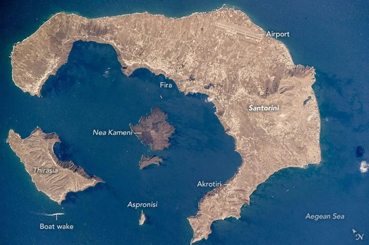 NASA satellite image of Santorini island showing the crescent-shaped caldera from space